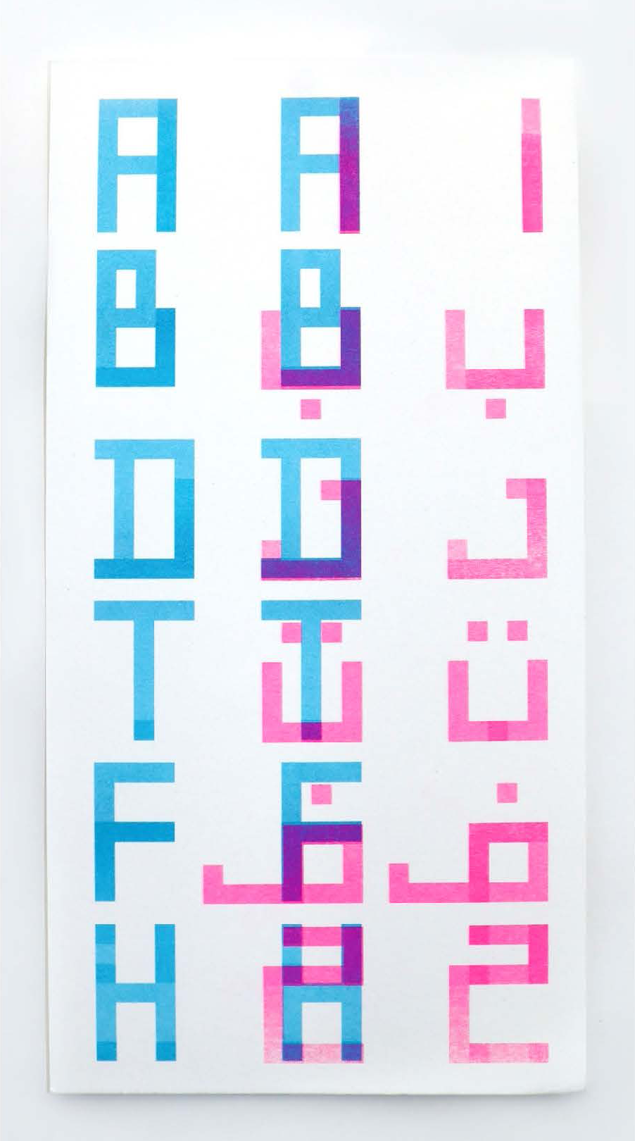 Riso print: Latin uppercase A–H in cyan, hybrid overlay in centre, Arabic letters in pink